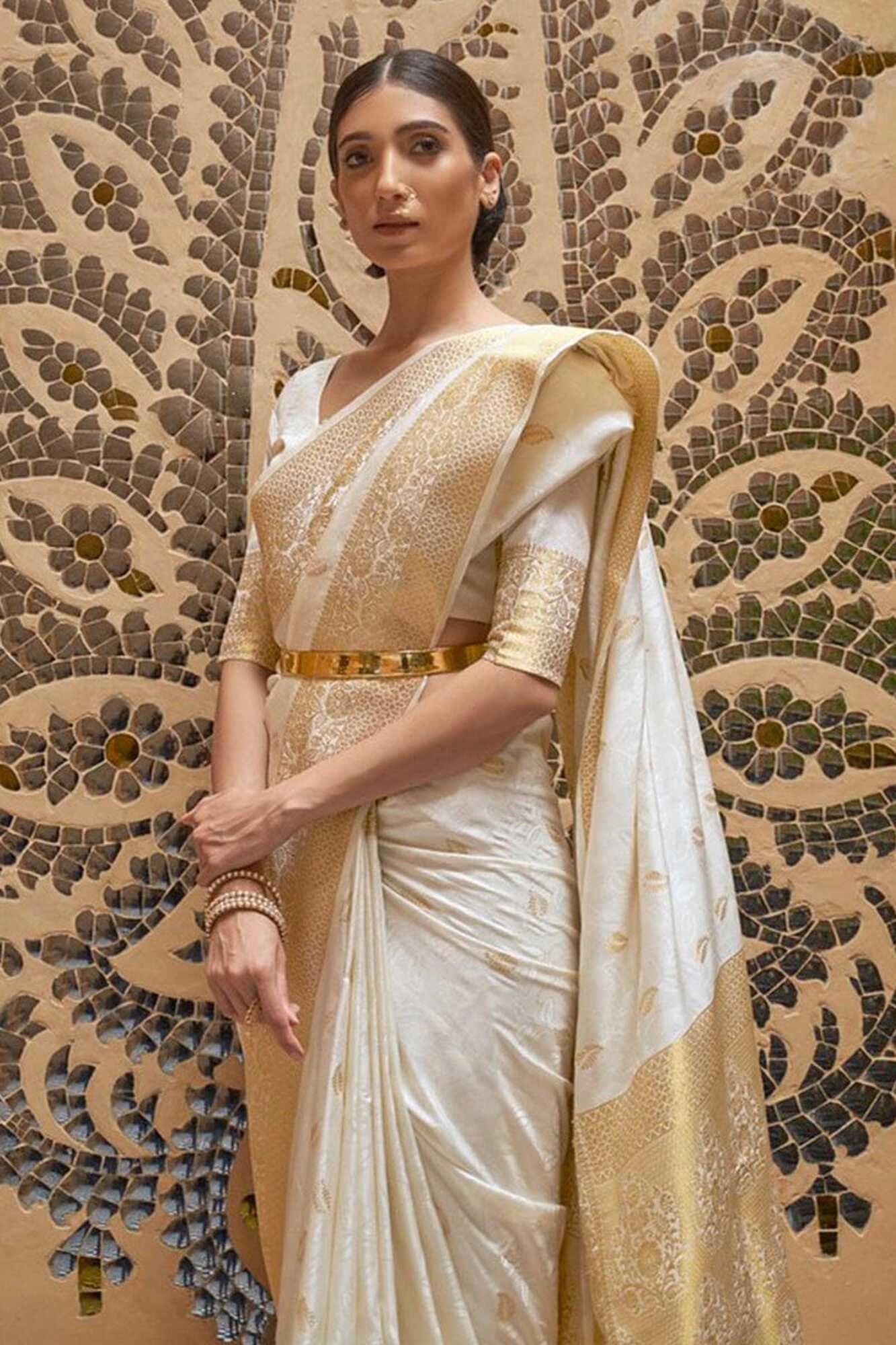 Off white soft banarasi silk saree with zari weaving work