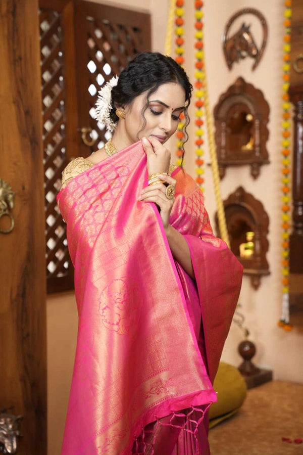 Rani pink color kanjivaram silk saree with zari weaving work