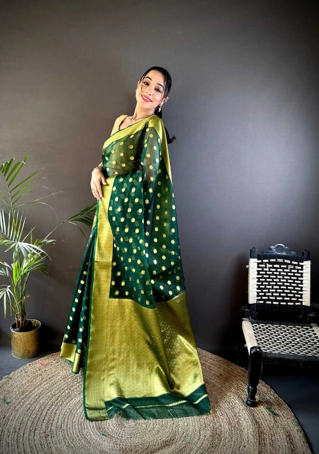 Green latest organza silk saree with zari weaving work