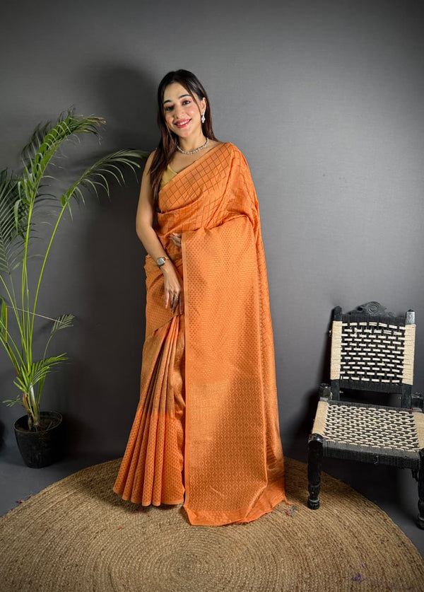 Orange color banarasi silk saree with zari weaving work