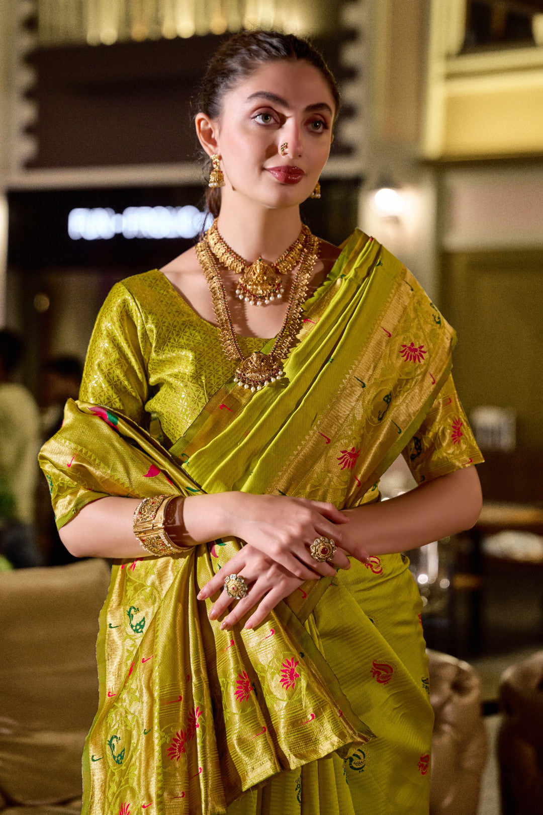 Traditional parrot green paithani silk saree with zari weaving work