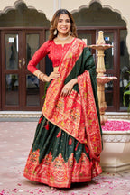 Green and red color dola silk lehenga with patola printed work