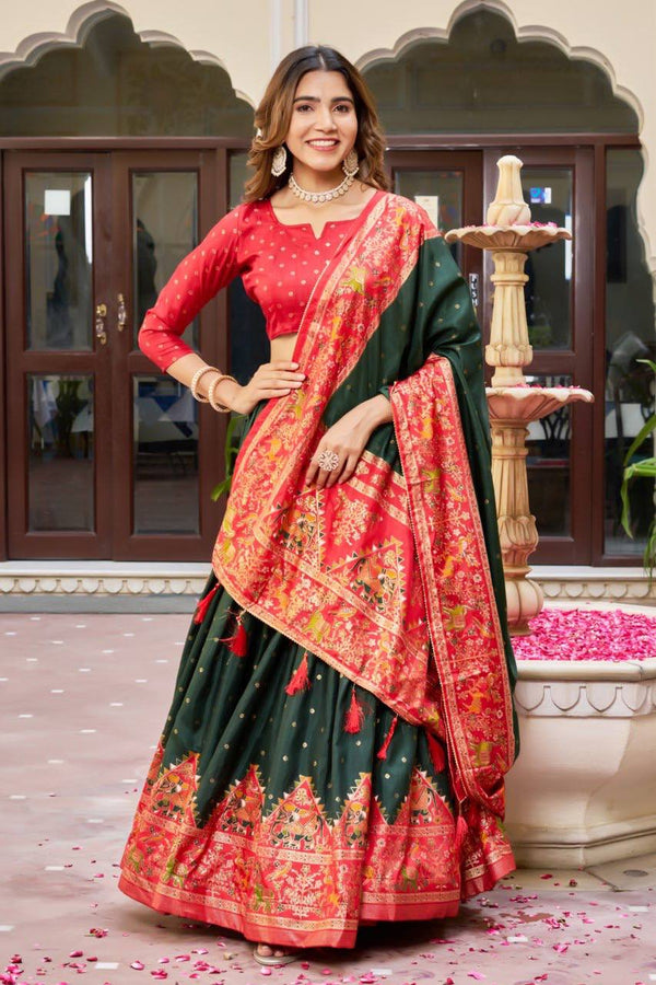 Green and red color dola silk lehenga with patola printed work