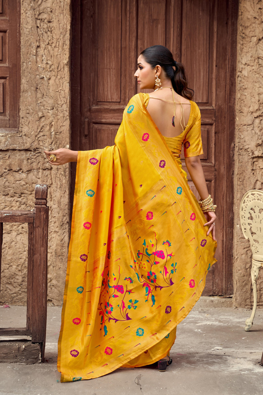 Traditional yellow paithani silk saree with zari weaving work