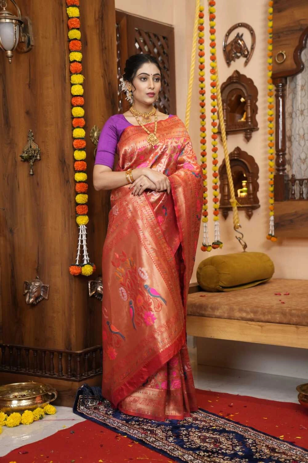 Red color paithani silk saree with zari weaving work