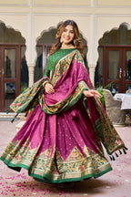 Magenta and green color dola silk lehenga with patola printed work