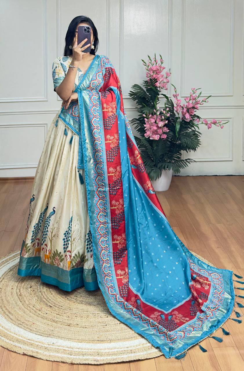 White and sky blue color dola silk lehenga with foil and patola printed work