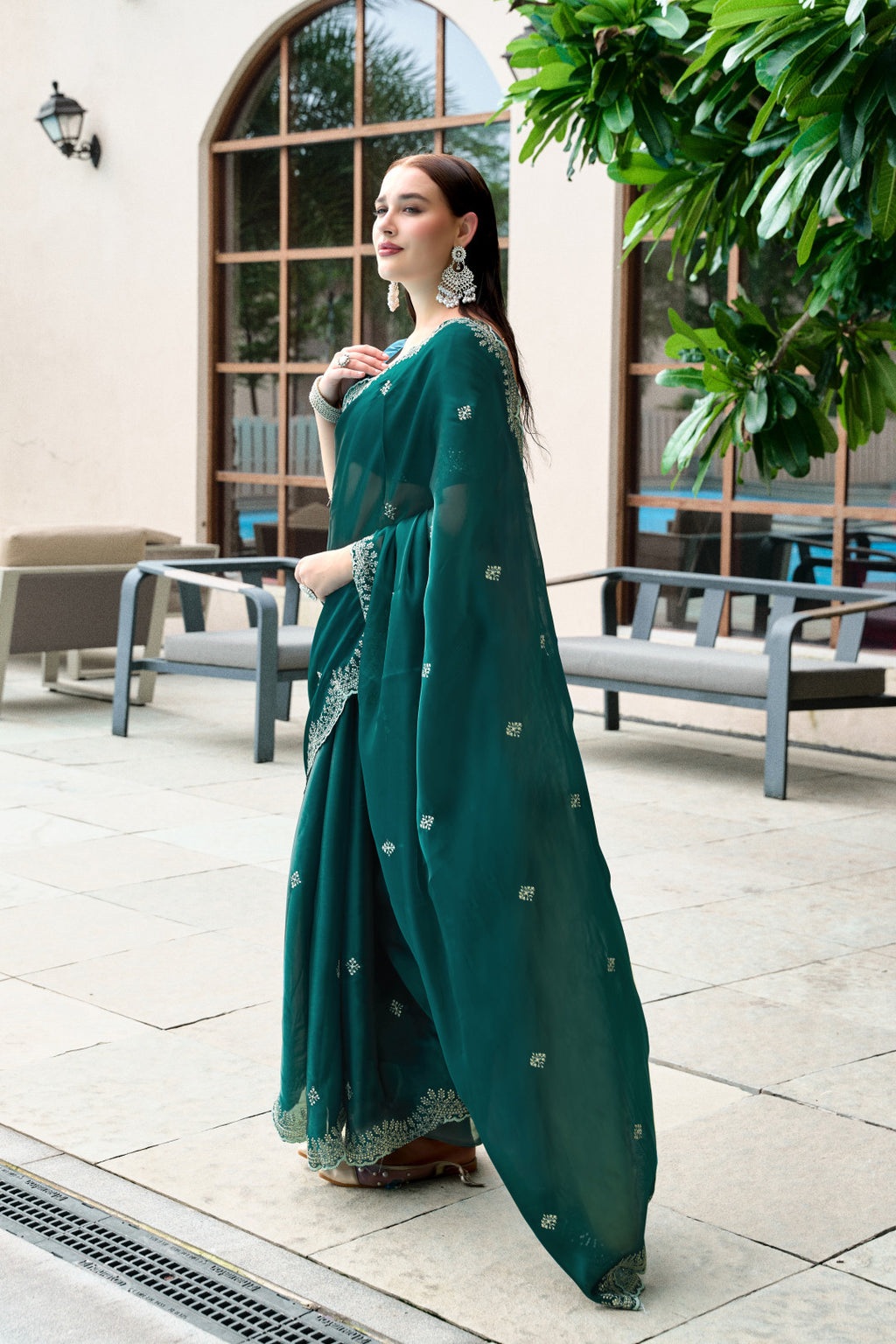 Dark green fancy shimmer chiffon saree with embroidery work