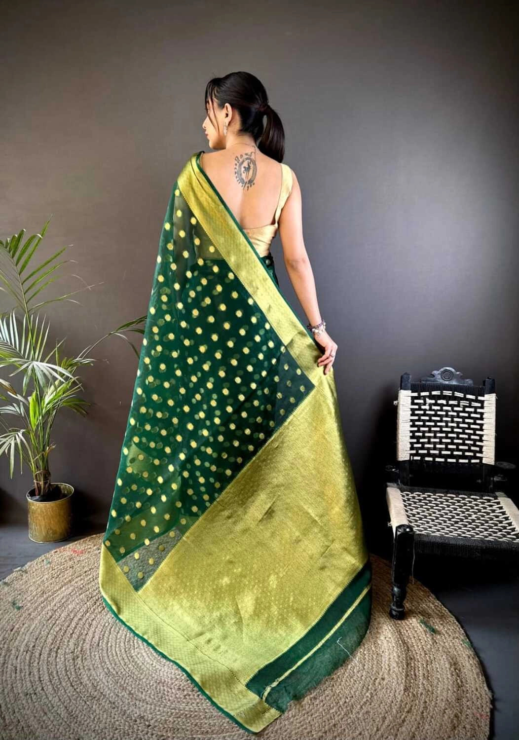 Green latest organza silk saree with zari weaving work