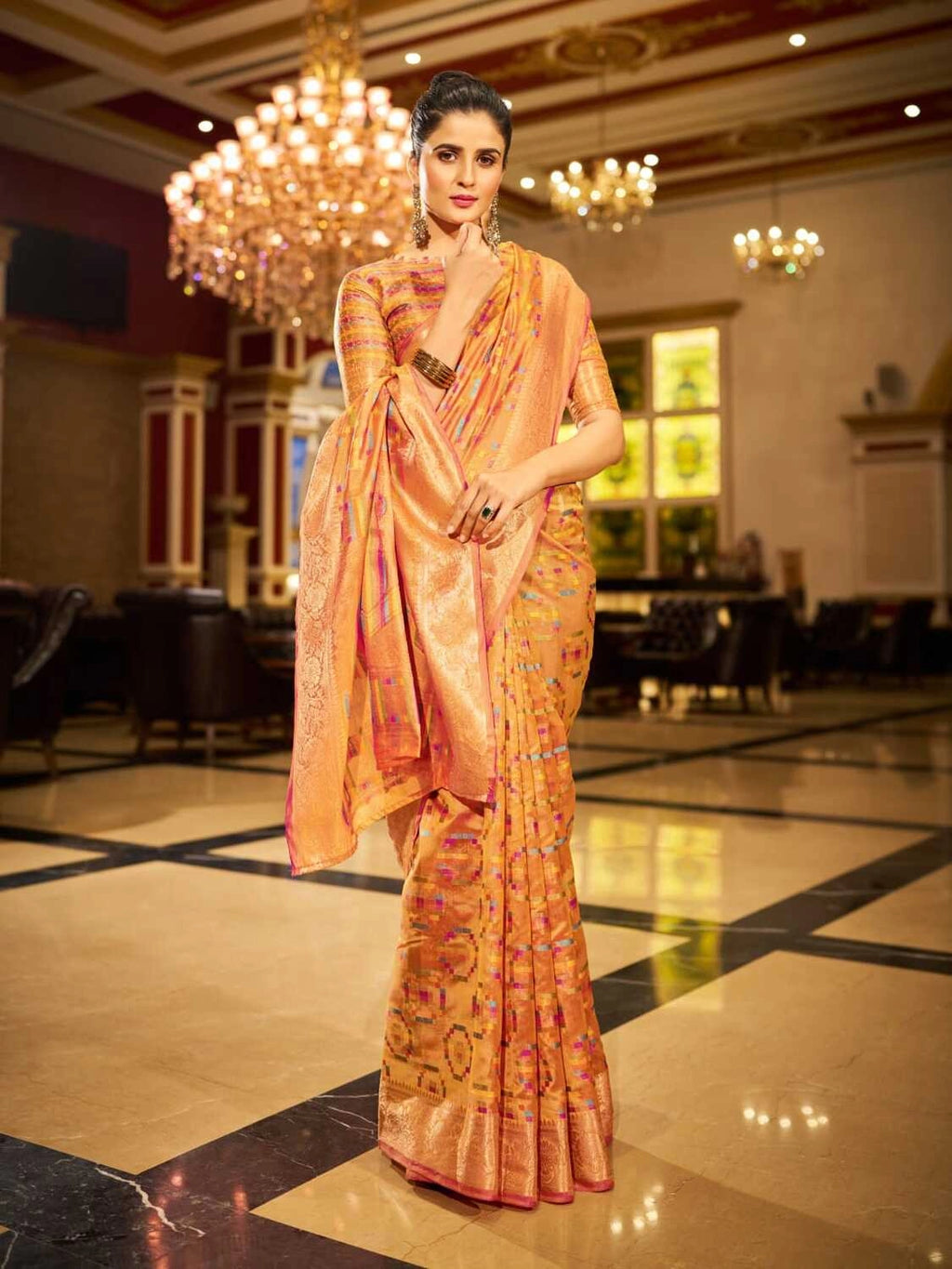 Orange soft organza silk saree with zari weaving work