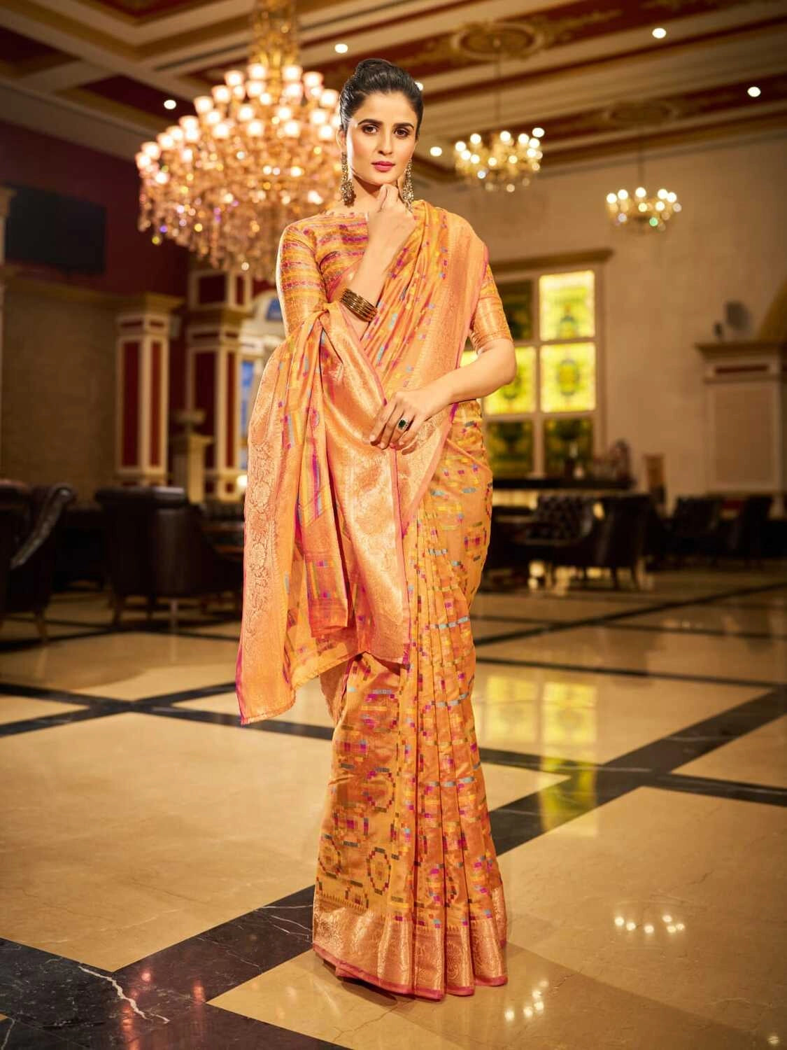 Orange soft organza silk saree with zari weaving work