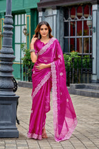 Rani pink fancy shimmer chiffon saree with embroidery work
