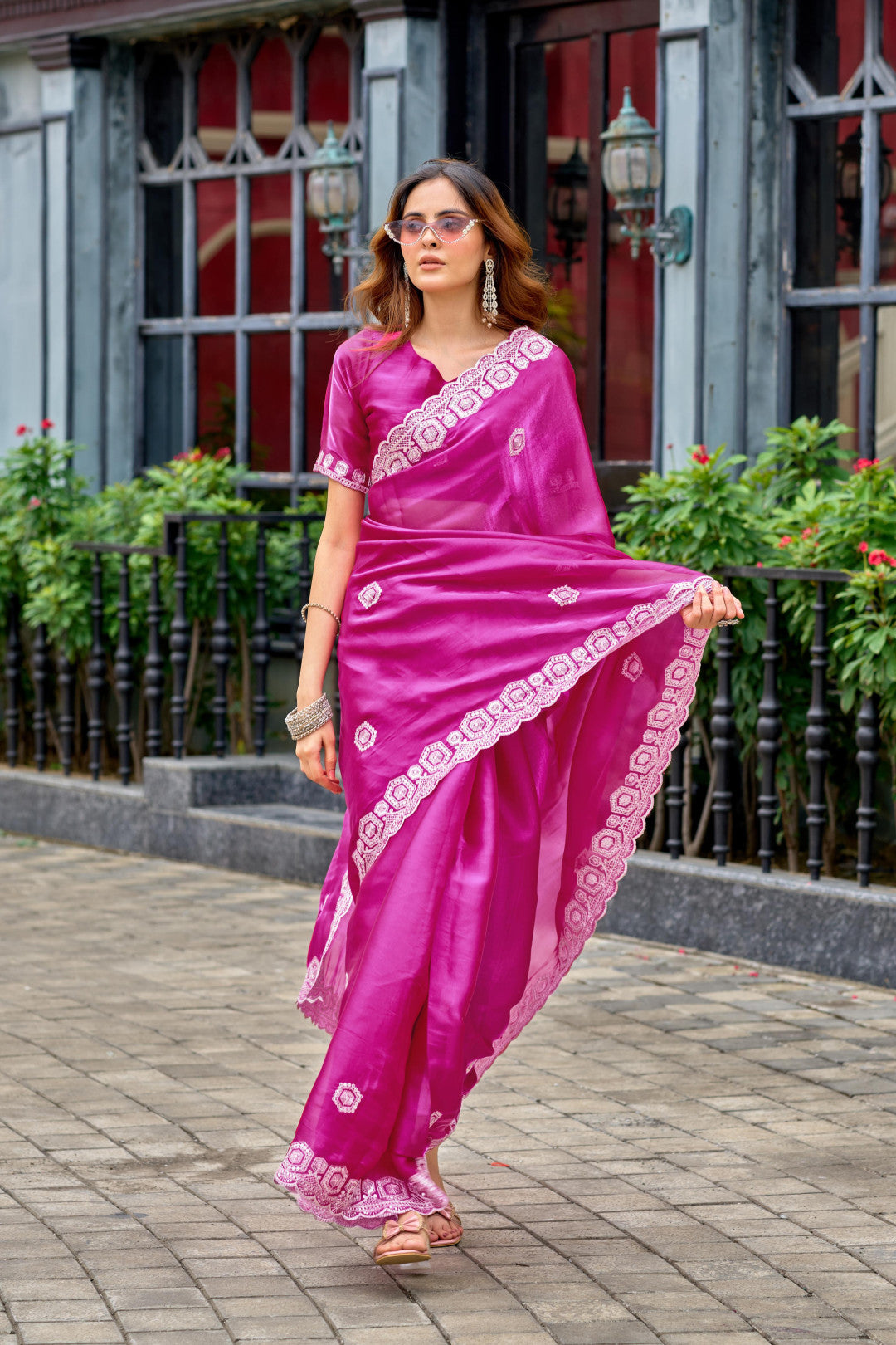 Rani pink fancy shimmer chiffon saree with embroidery work