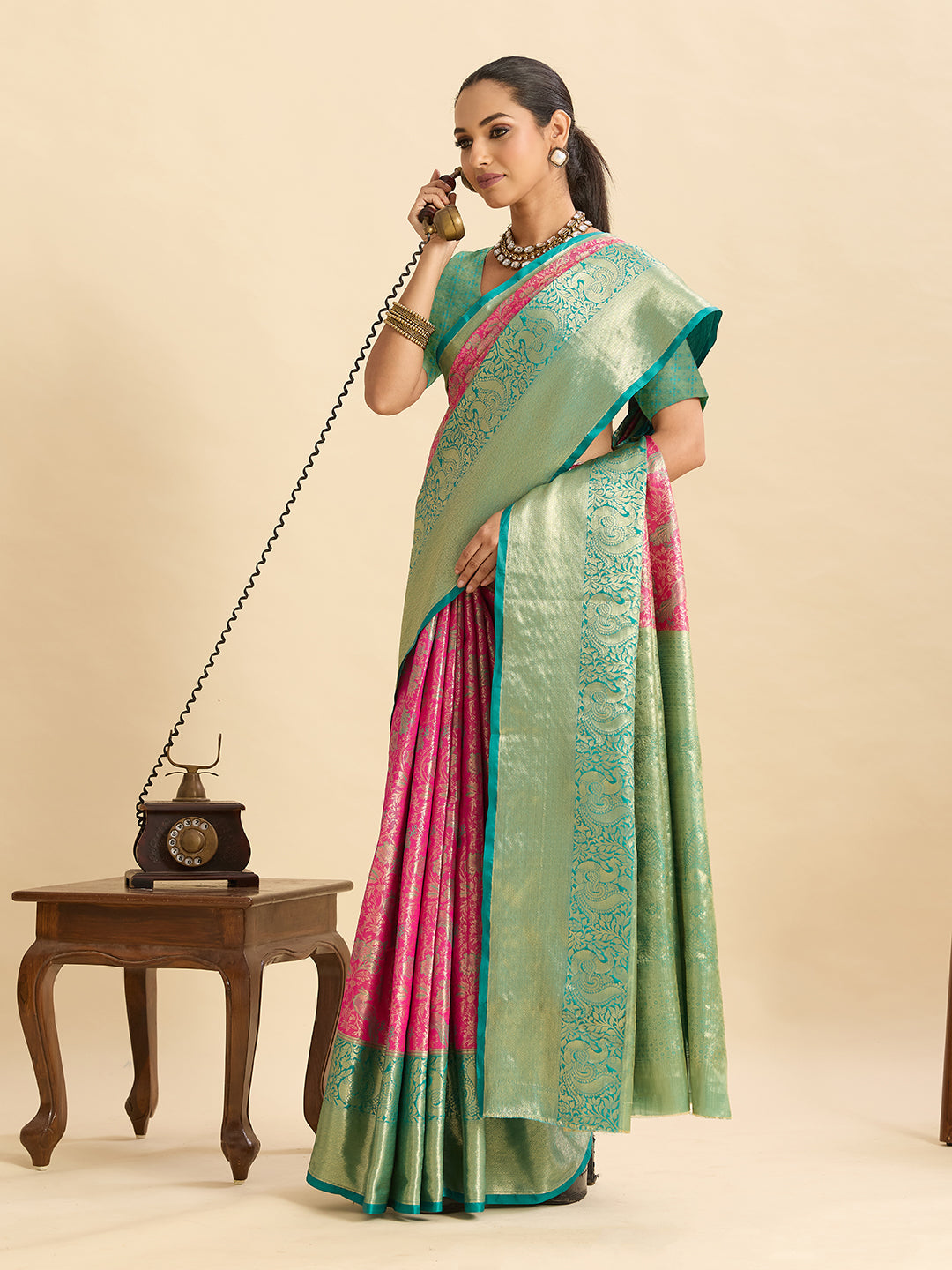 Pink kanjivaram silk saree with zari weaving work and big border