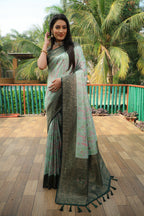 Sea green color kanjivaram silk saree with zari weaving work