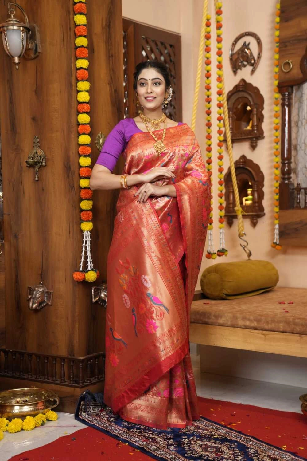 Red color paithani silk saree with zari weaving work