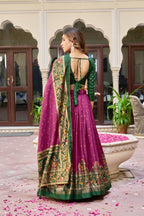 Magenta and green color dola silk lehenga with patola printed work
