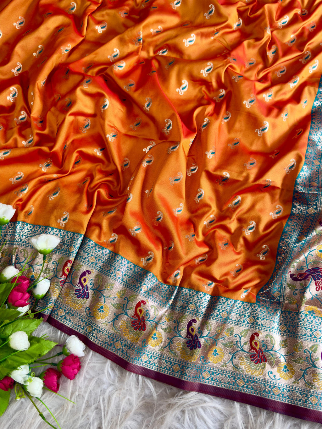 Orange traditional paithani silk saree with peacock zari weaving work