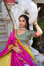 Yellow color tussar silk lehenga with meenakari printed work