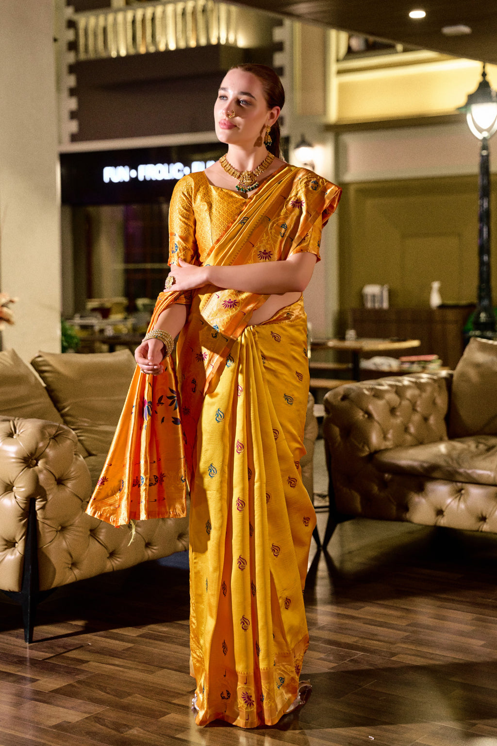 Traditional yellow paithani silk saree with zari weaving work