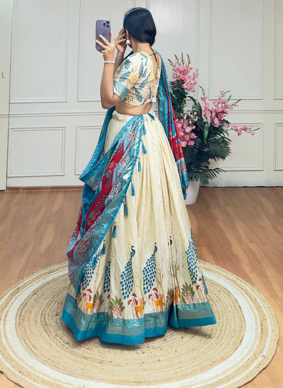 White and sky blue color dola silk lehenga with foil and patola printed work