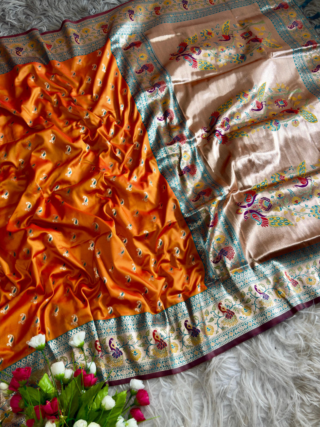 Orange traditional paithani silk saree with peacock zari weaving work