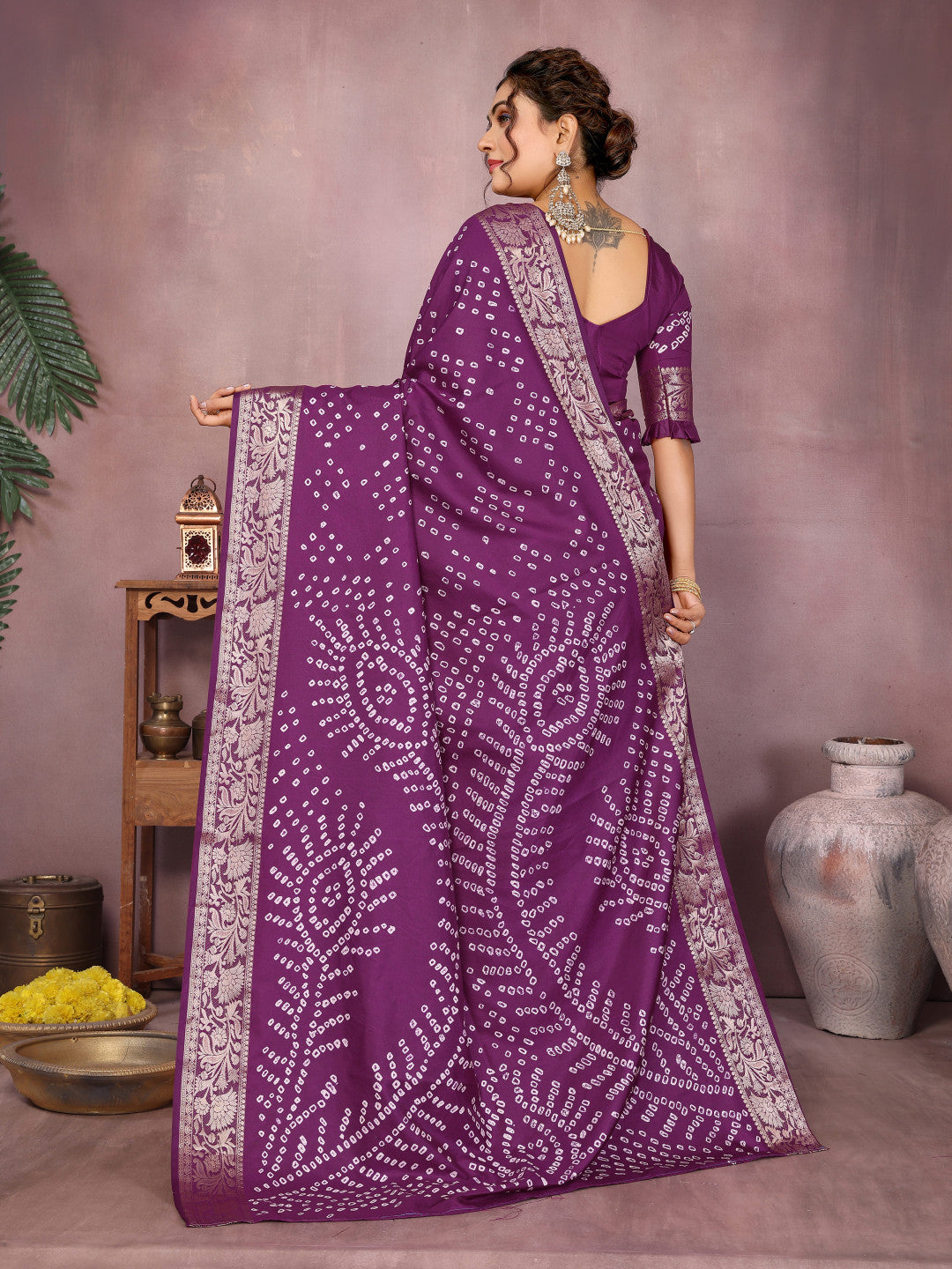 Magenta colour hand bandhej bandhani saree with zari weaving work