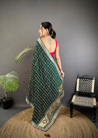 Dark green traditional blooming vichitra khadi bandhej silk saree with sequence work