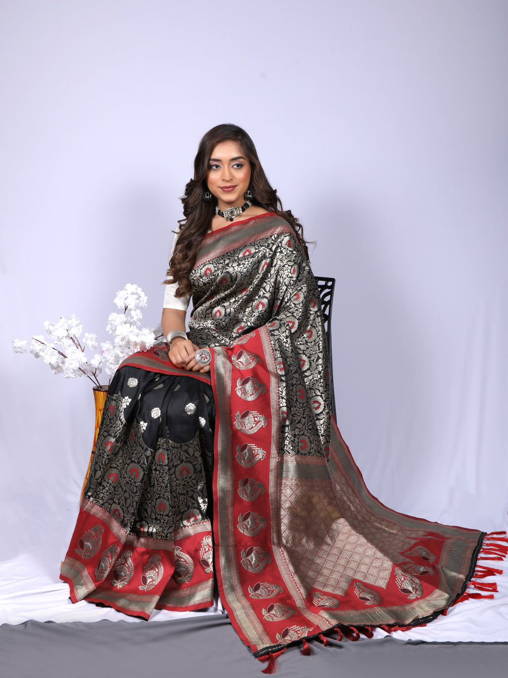 Black color kanchipuram silk saree with zari weaving work
