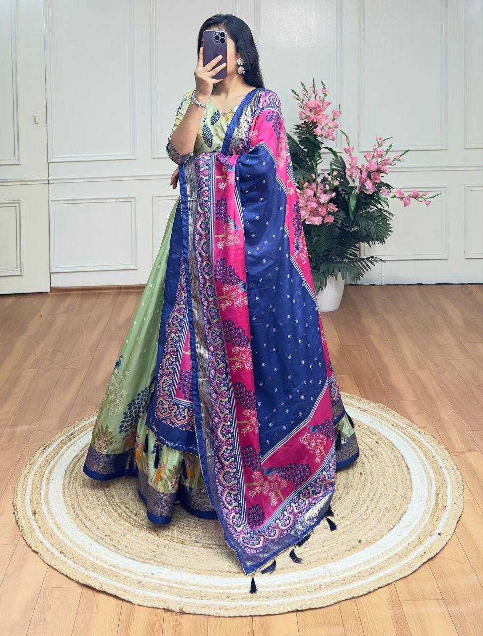 Pista green and blue color dola silk lehenga with foil and patola printed work