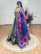 Pista green and blue color dola silk lehenga with foil and patola printed work