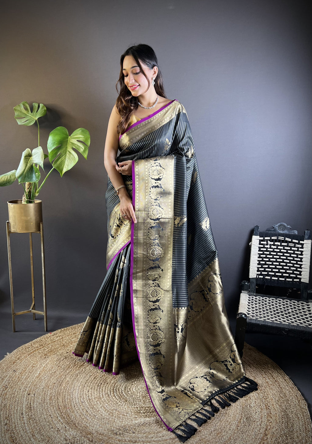 Black kanchipuram silk saree with golden zari weaving work