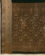 Dark green color soft kanchipuram silk saree with zari weaving work