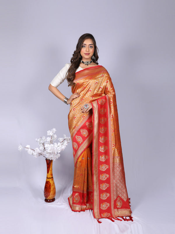 Orange color kanchipuram silk saree with zari weaving work