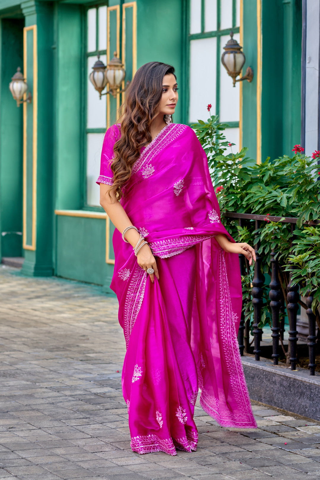 Rani pink fancy shimmer chiffon saree with embroidery work