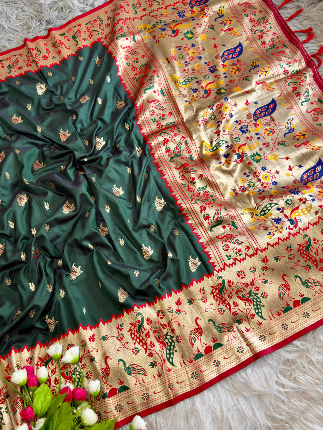 Dark green traditional paithani silk saree with peacock zari weaving work