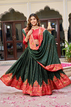 Green and red color dola silk lehenga with patola printed work