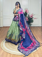 Pista green and blue color dola silk lehenga with foil and patola printed work