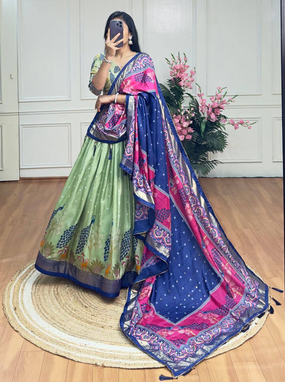 Pista green and blue color dola silk lehenga with foil and patola printed work