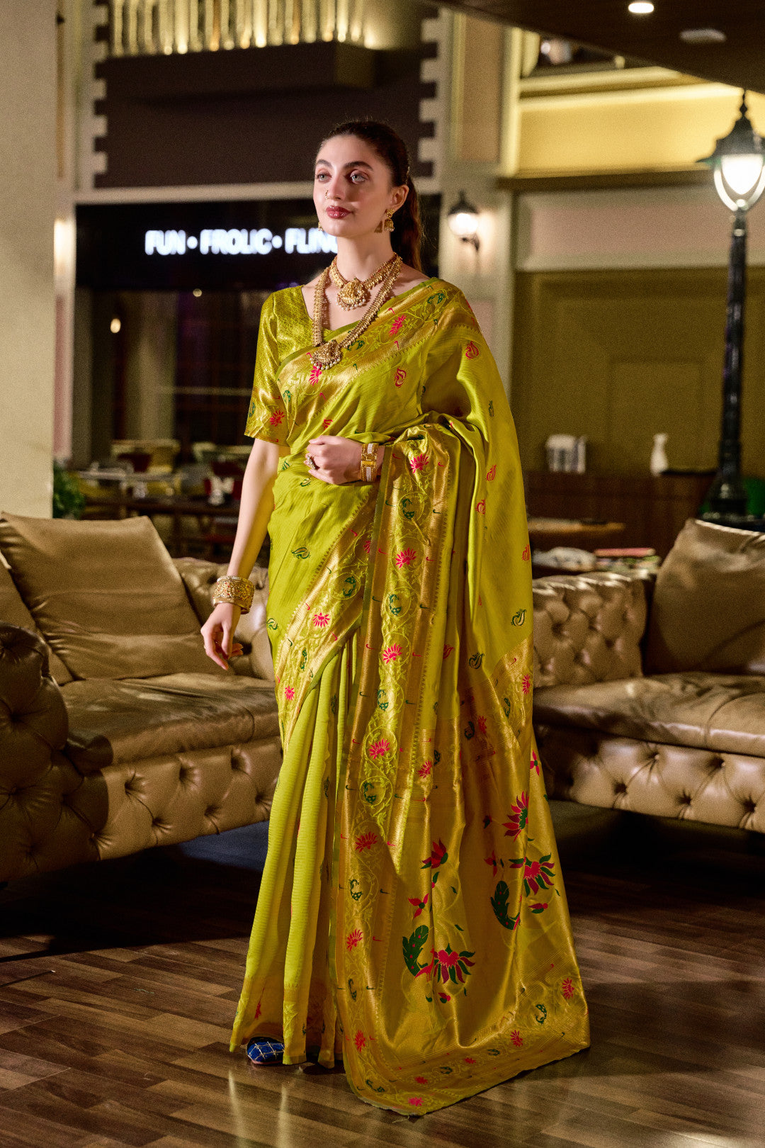 Traditional parrot green paithani silk saree with zari weaving work
