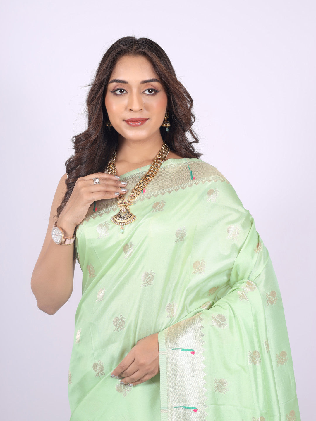 Pista green color paithani silk saree with zari weaving work