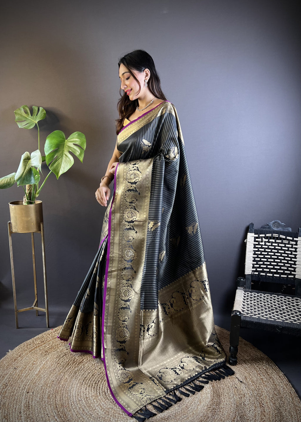 Black kanchipuram silk saree with golden zari weaving work