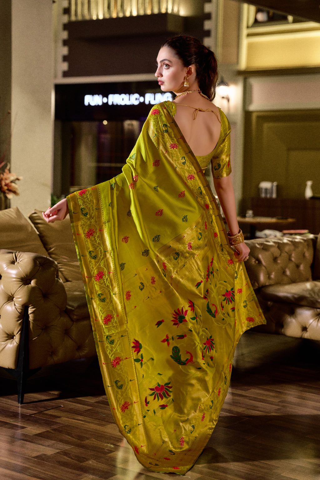 Traditional parrot green paithani silk saree with zari weaving work