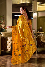 Traditional yellow paithani silk saree with zari weaving work