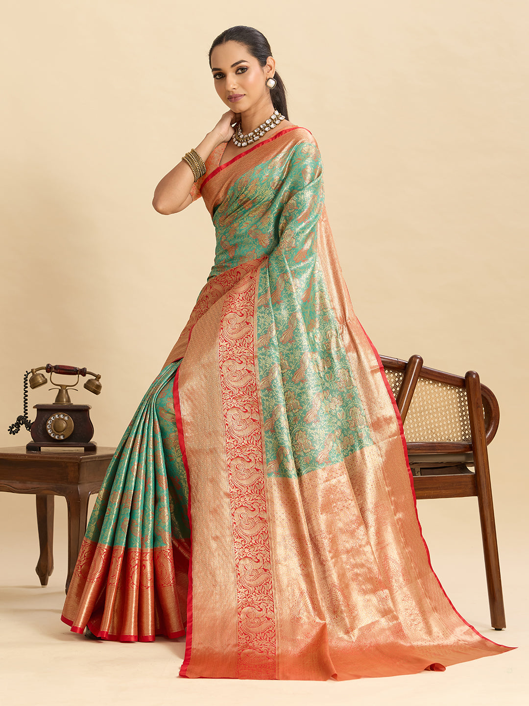 Green kanjivaram silk saree with zari weaving work and big border