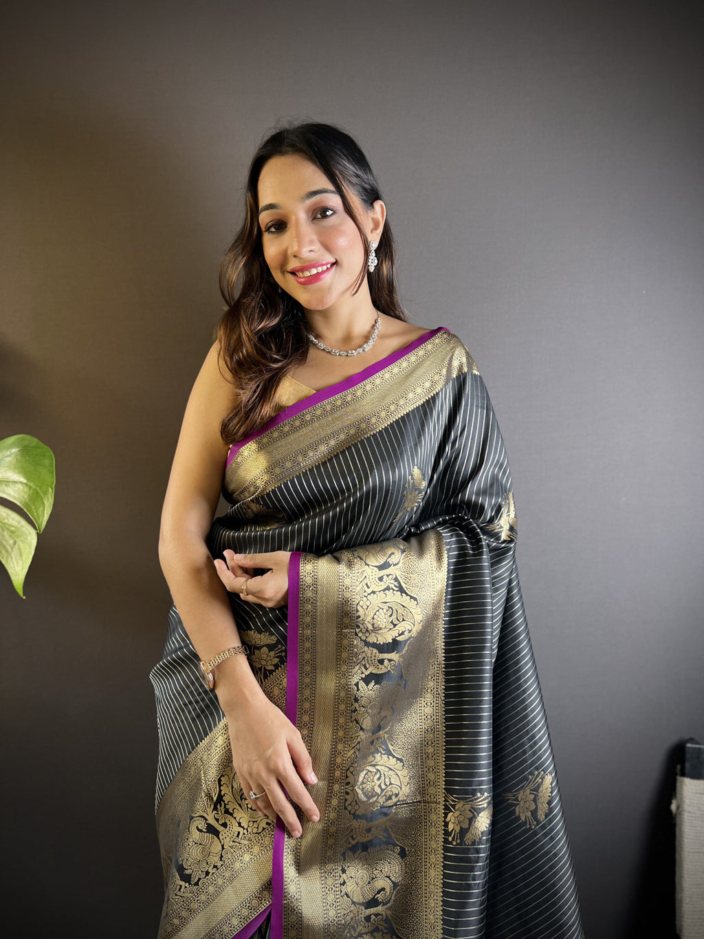 Black kanchipuram silk saree with golden zari weaving work