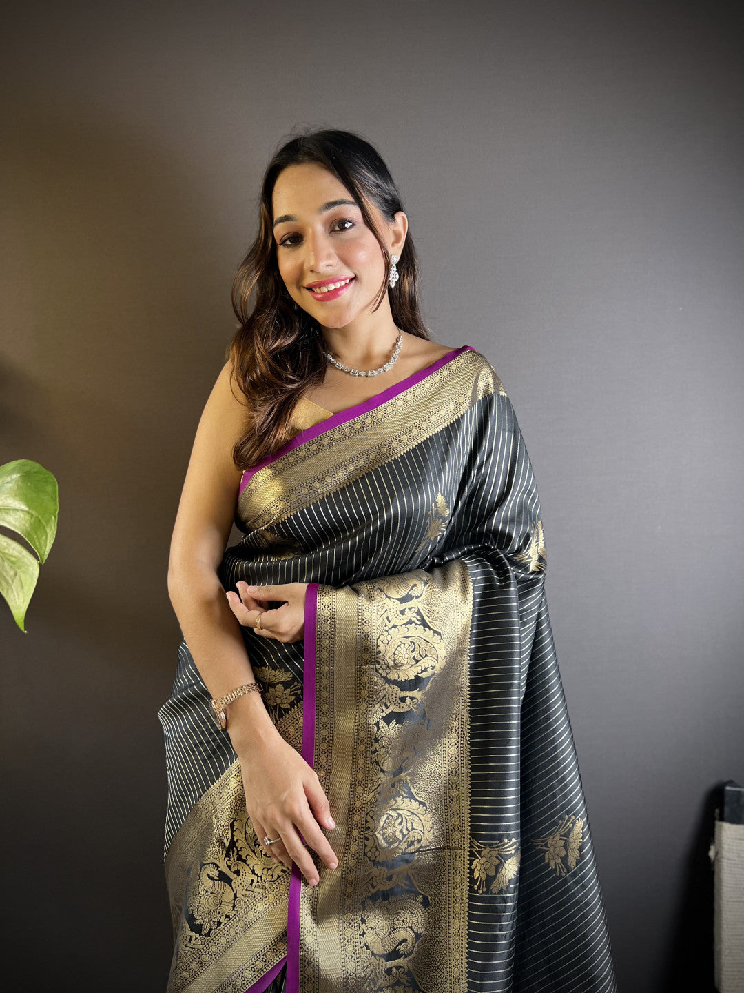 Black kanchipuram silk saree with golden zari weaving work