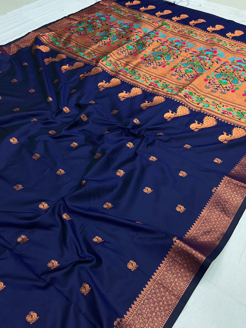 Navy blue color paithani silk saree with zari weaving work