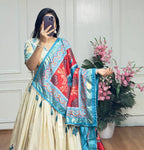 White and sky blue color dola silk lehenga with foil and patola printed work