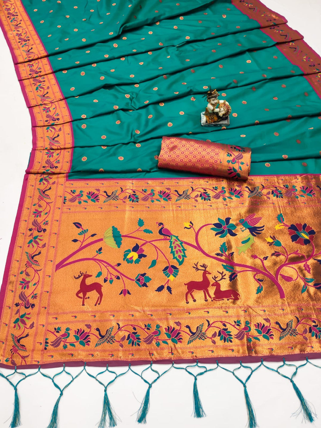 Rama green color paithani silk saree with zari weaving work